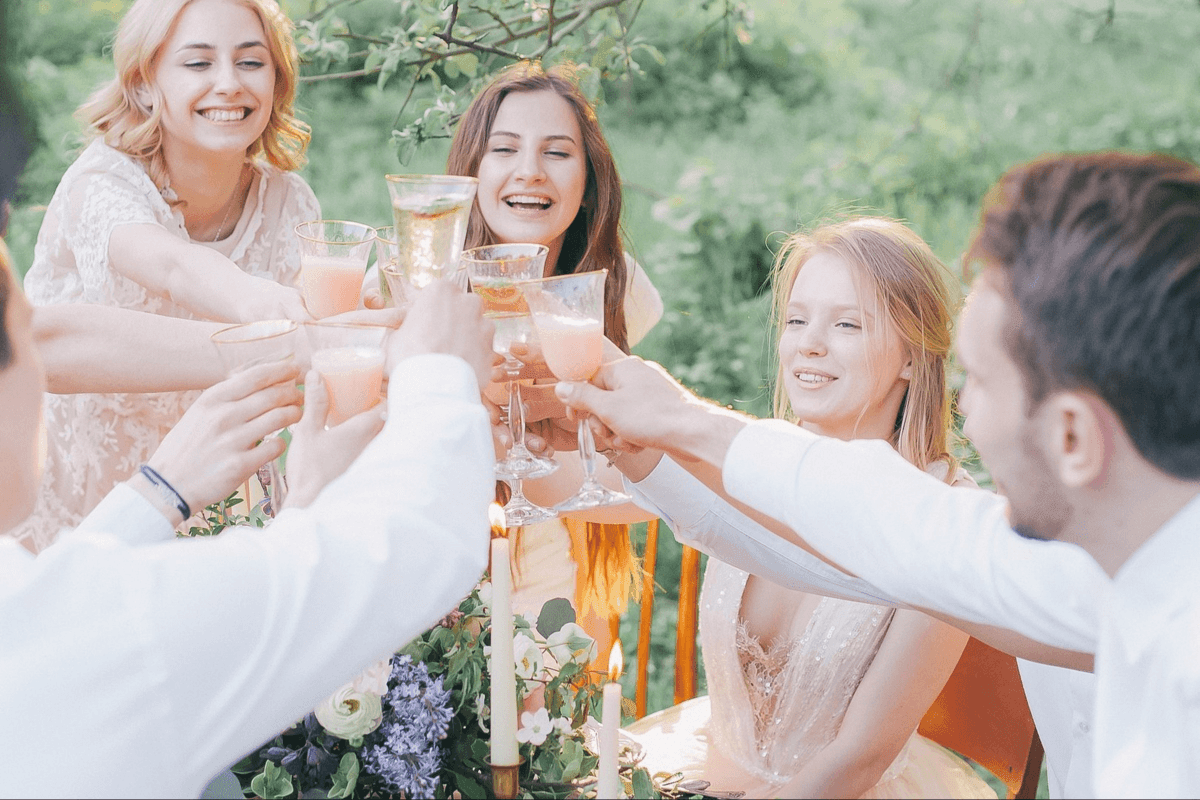 Young people toasting with wine glasses